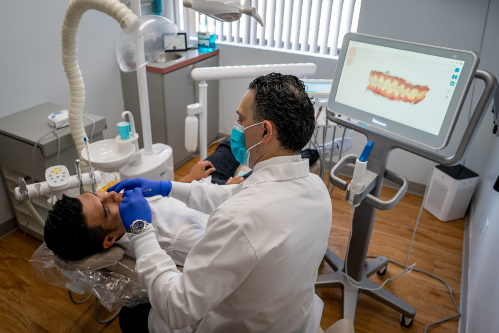 patients in dental chair in process of dental treatment